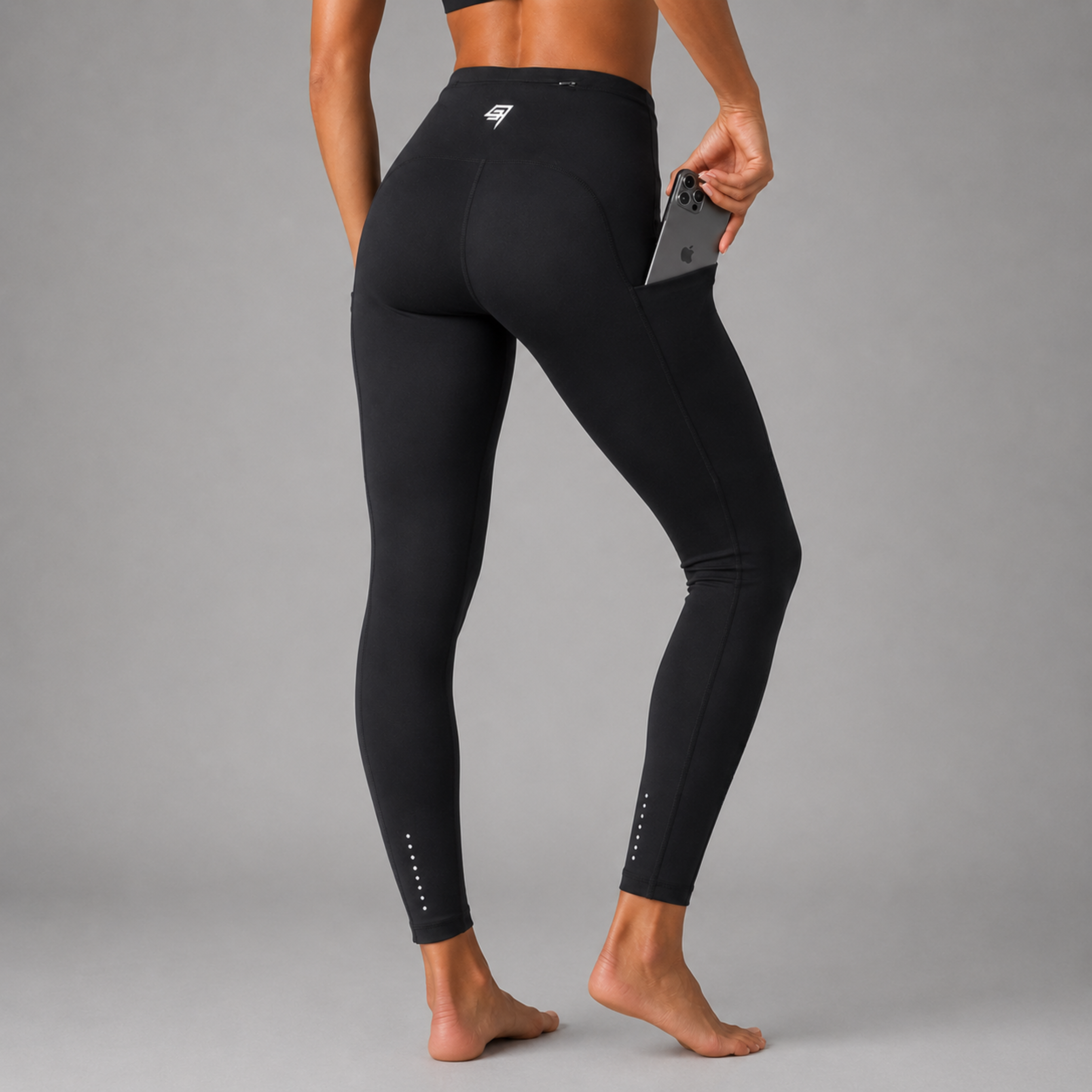 THR9VE ASCENT Pocket Leggings in black — back view with phone in side pocket