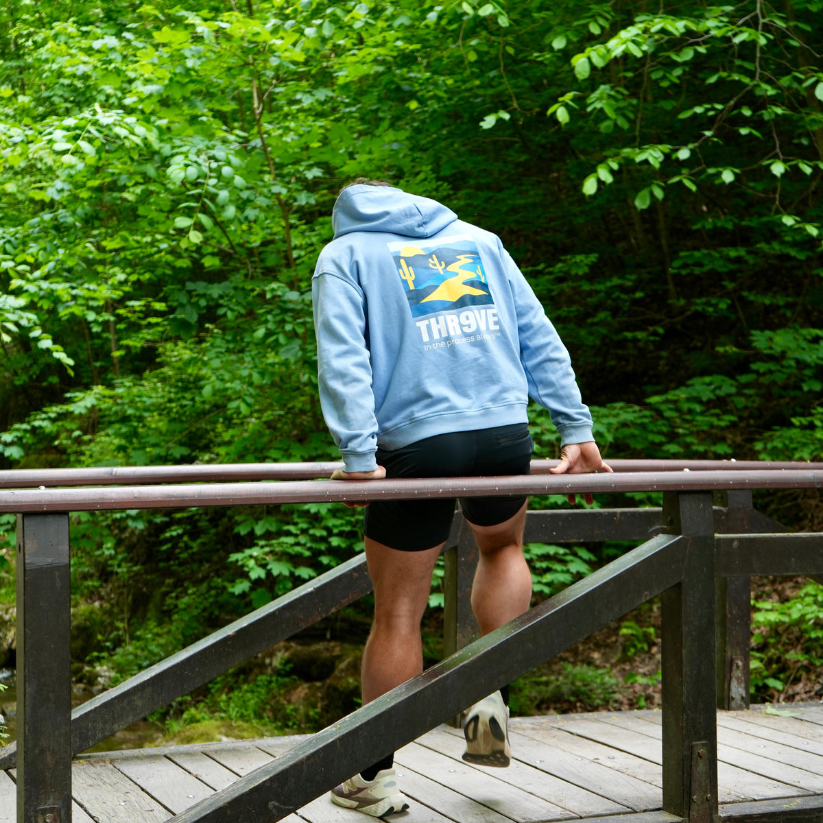 THR9VE Organic Cotton Hoodie in dusty sky blue — back view, lifestyle shot 2