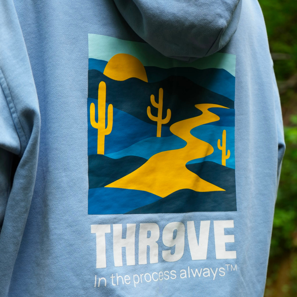 THR9VE Organic Cotton Hoodie in dusty sky blue — back view, lifestyle shot 4
